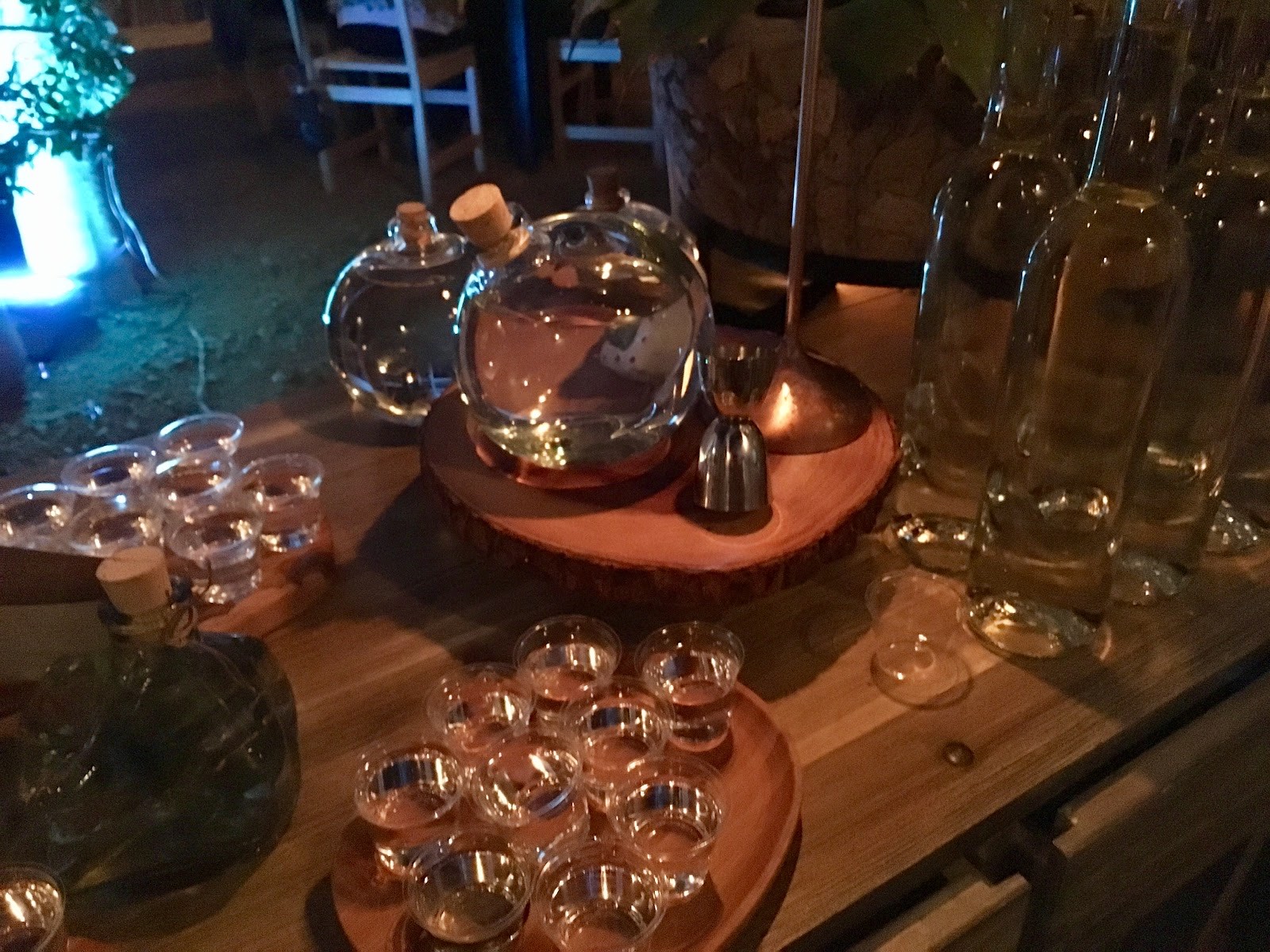 a mezcal pour with fine glassware