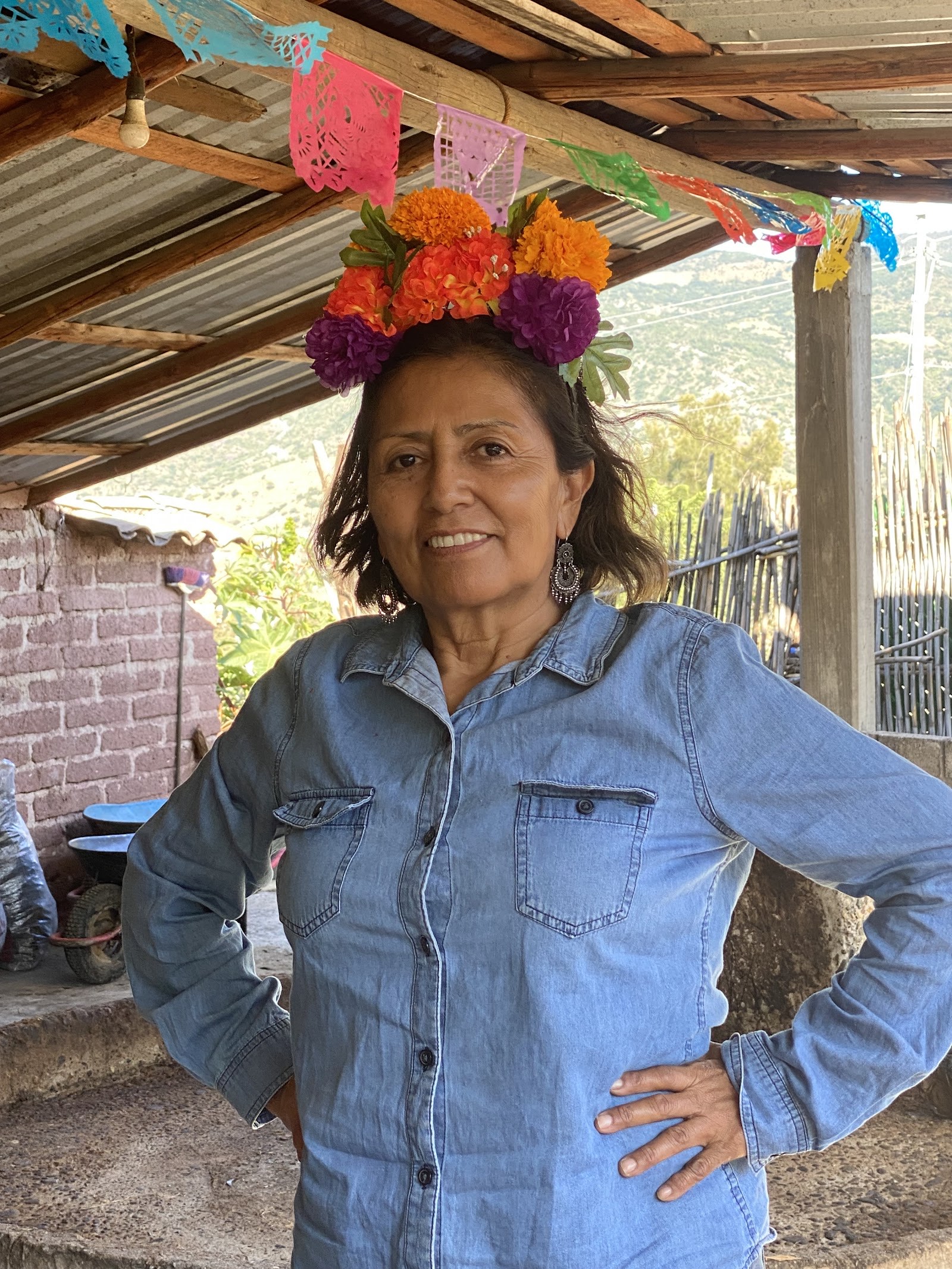 smiling woman in a marigold crown
