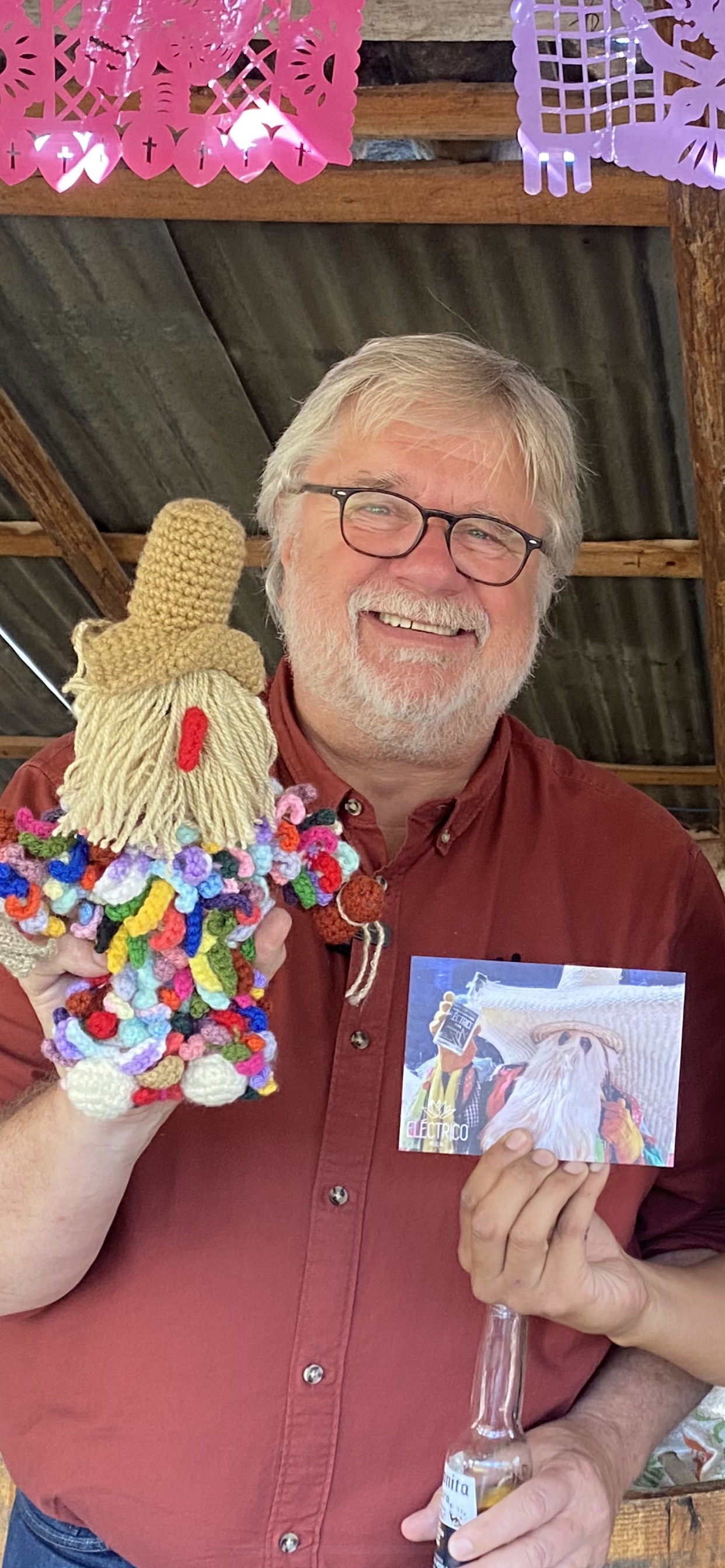 a man with a crochet doll