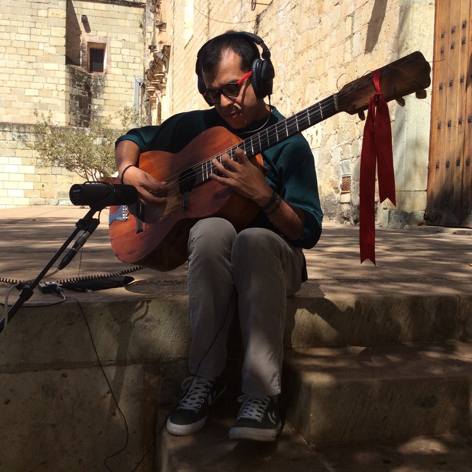 a guitarist plays outdoors