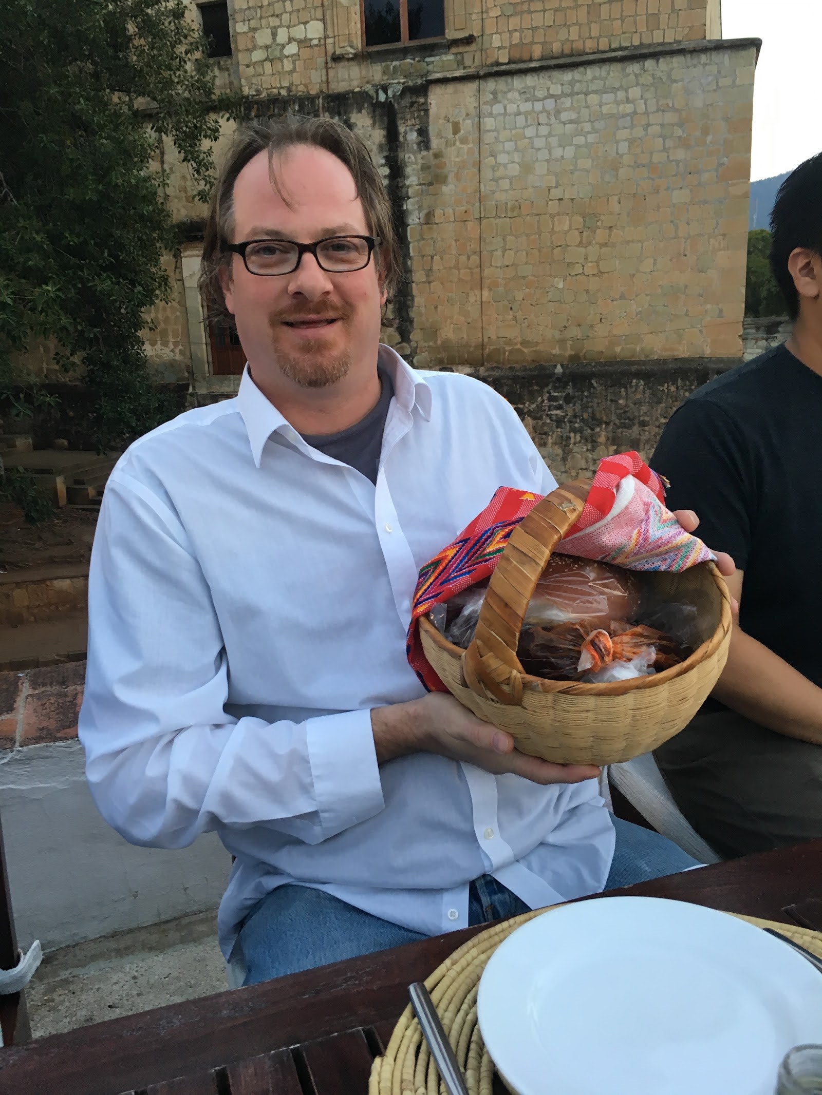 holding a woven gift basket