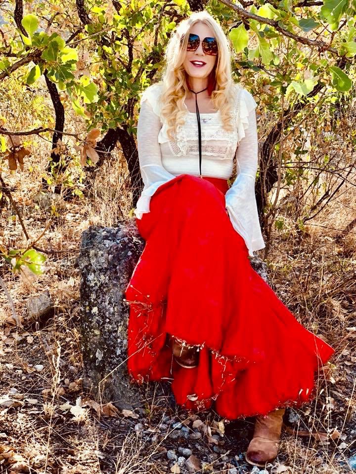in a red skirt, outdoors
