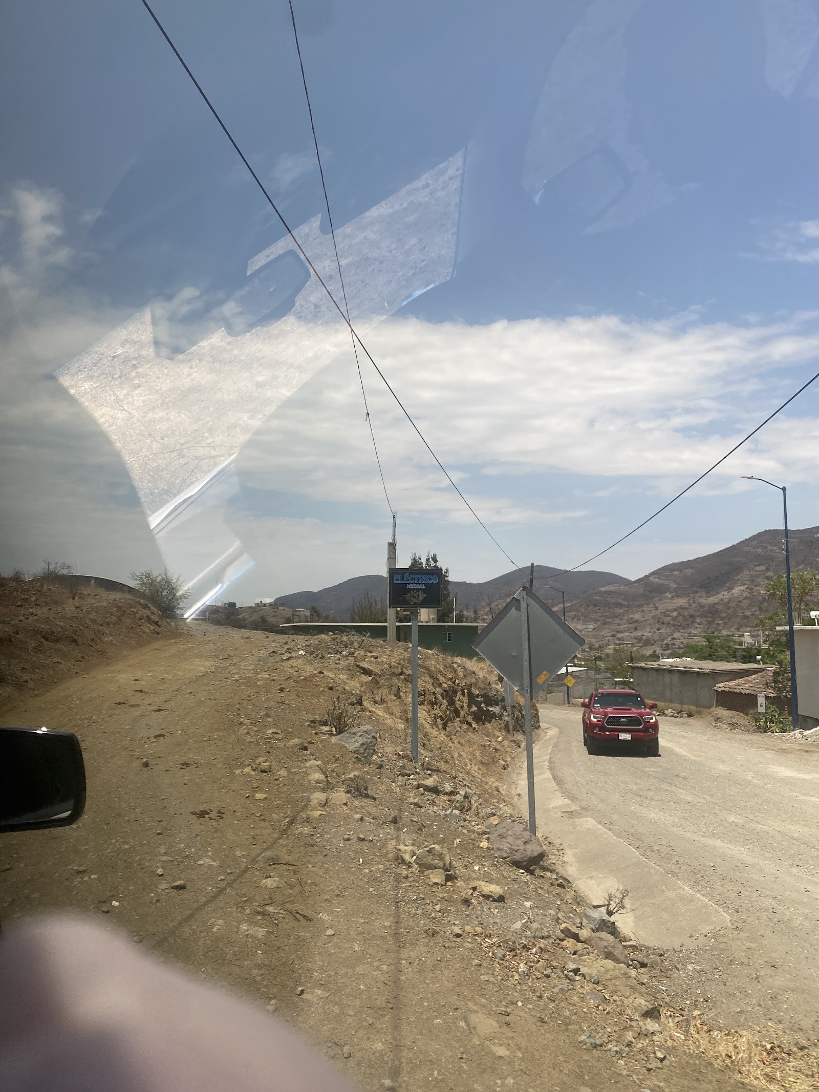 a dirt road through the hills